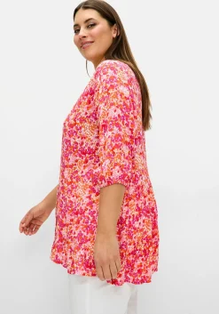 Crêpe-Bluse mit Blumendruck und Volant am Saum<sheego Fashion