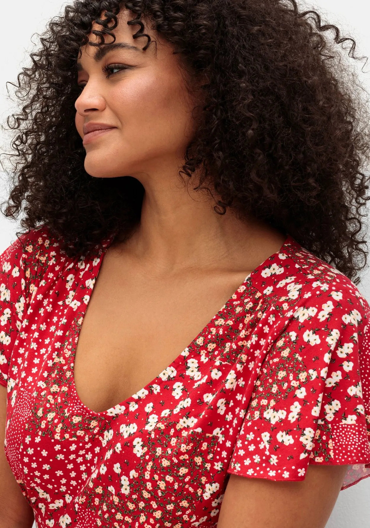 Jerseykleid in Midilänge, mit Blumenprint<sheego Hot