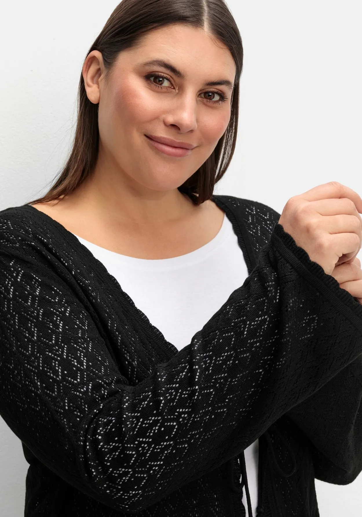 Lange Ajour-Strickjacke mit Bindeband<sheego Outlet