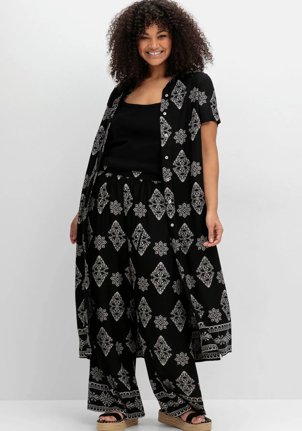 Schlupfhose mit Allover- und Bordürendruck<sheego by Joe Browns Sale